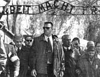 Netanyahu, behind thug, visiting Auschwitz