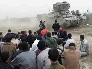 Israeli tank, demonstators